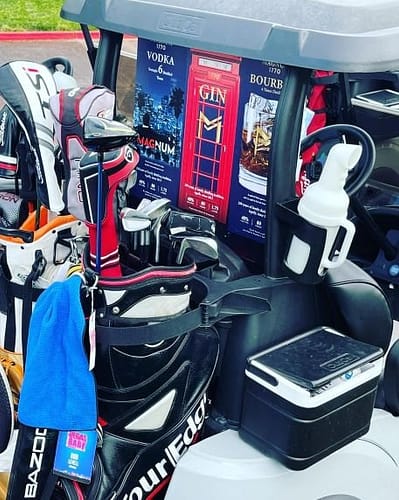golf cart with 3 boxes of liquor Magnum Finest Spirits co-sponsors 2021 International Vegas Baby Pro-Am Golf Tournament